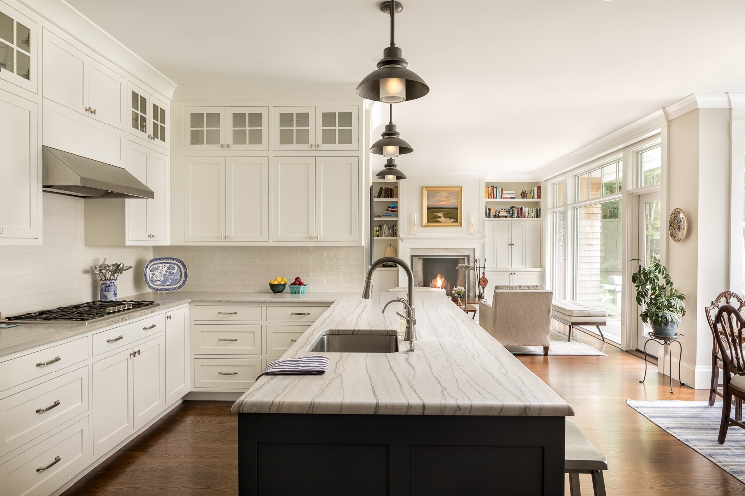 Large kitchen island forms the center of this shaker style kitchen and provides seating.