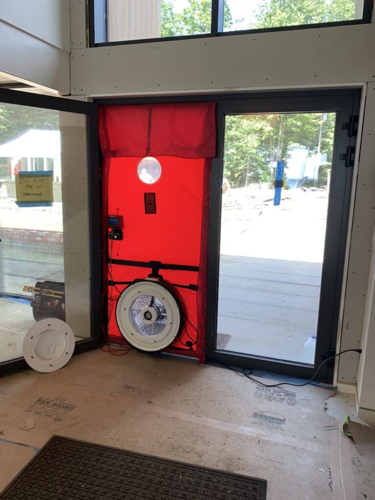 Blower door test for high performance building