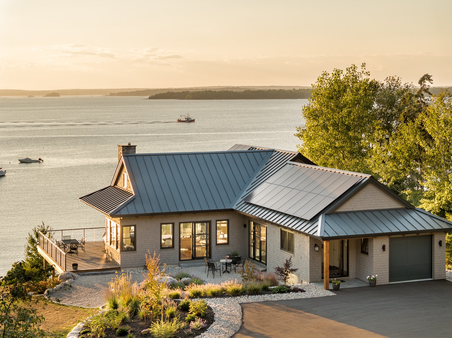 Aerial view of house built by Warren Construction Group in Harpswell, Maine. Overlooking the ocean with exceptional views of the Maine Coast.