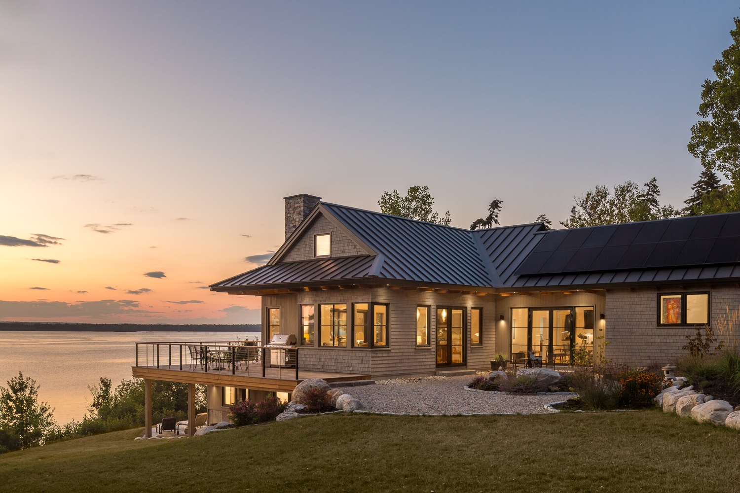 Sunset on a house in Harpswell Maine. Built by Warren Construction Group this house looks out over Maquoit and Middle Bay in Harpswell.