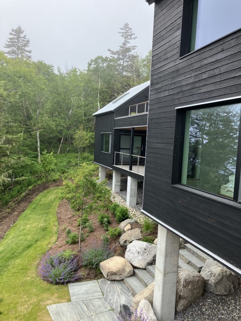 House and Guest House on the ocean in Mid-Coast Maine. Shou sugi ban siding provides the black charred look.